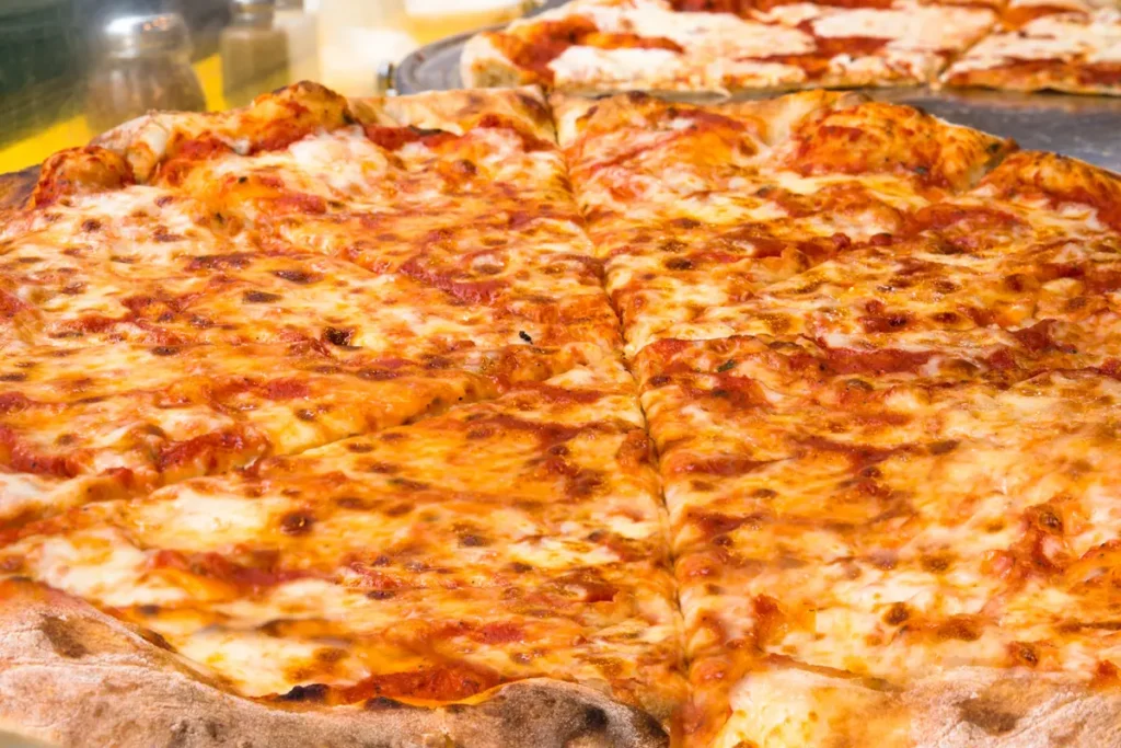 Fresh cheese pizza with melted mozzarella from WiseGuys Pizza