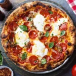 The Italian Deli Pizza from WiseGuys—loaded with deli meats, savory flavors, and melty cheese on a perfect crust.