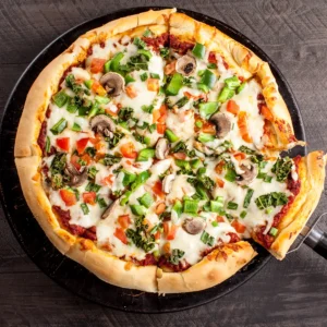 Veggie pizza topped with fresh vegetables at WiseGuys Pizza