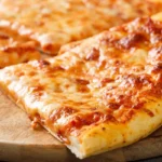 Warm cheese pizza with melted mozzarella from WiseGuys Pizza