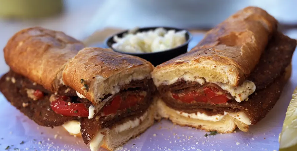 The Cousin Vinnie sub sandwich featuring breaded chicken cutlet, roasted peppers and ricotta