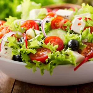 A vibrant salad with crisp lettuce, juicy tomatoes, and other fresh ingredients, showcasing the quality of Wise Guys